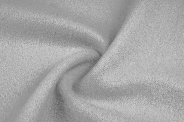 istock Texture, background, pattern. Woolen fabric for outdoor clothing, white gray 1077727808