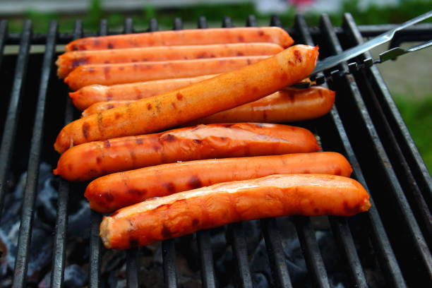 istock Burning sausages outdoors 1077728074