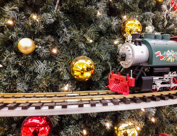 istock Christams train before christmas tree with balls 1077730462