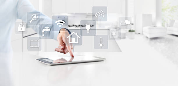 istock smart home automation control concept hand touch digital tablet screen with gray symbols icons on kitchen background web banner and copy space template 1077731166