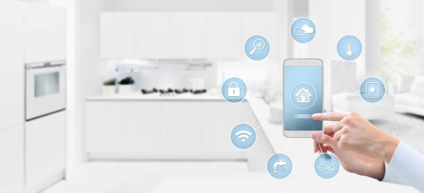 istock smart home automation control concept hand touch cell phone screen with blue symbols icons on kitchen background web banner and copy space template 1077731180