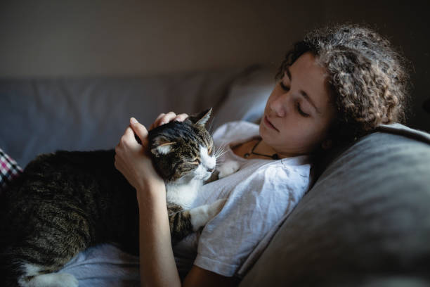 istock Young woman with her cat 1077732914