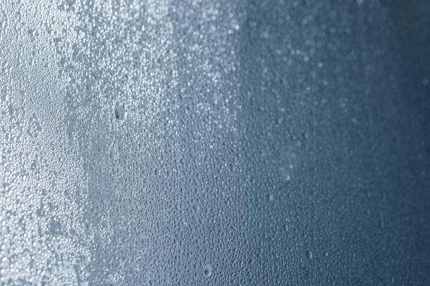 istock steamy window glass background macro selective focus 1077737840