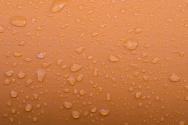 istock water drops on plastic orange tube macro 1077738256