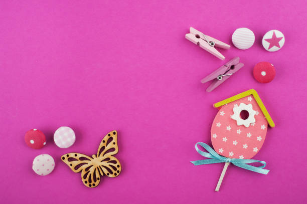 istock Pink working desk with butterfly 1077738754