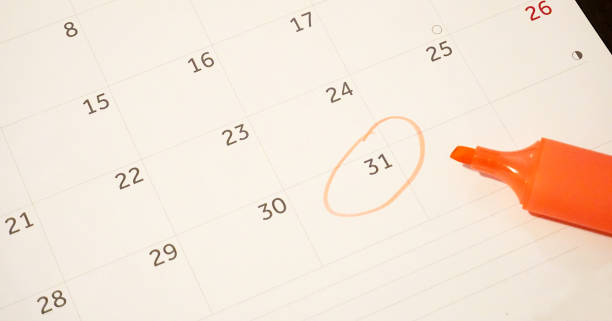 istock Calendar sheet with 31st day circled with orange pen 1077739768