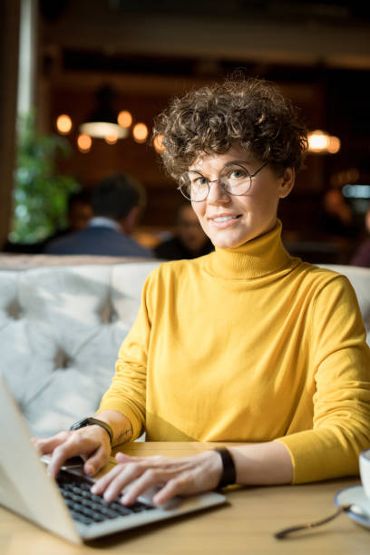 istock Cheerful hipster woman working with laptop 1077743134