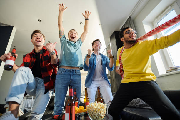istock Happy football fans 1077743798
