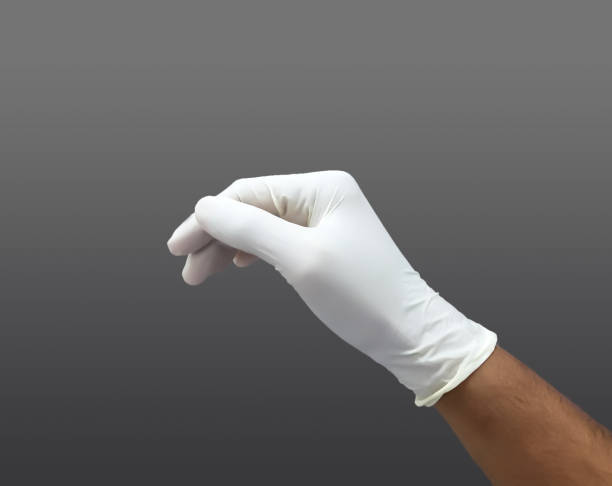 Sterile Glove In Hand Sterile Glove In Hand Before Surgical Procedure teatro stock pictures, royalty-free photos & images