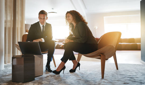 istock Two diverse businesspeople working together online with a laptop 1077754072