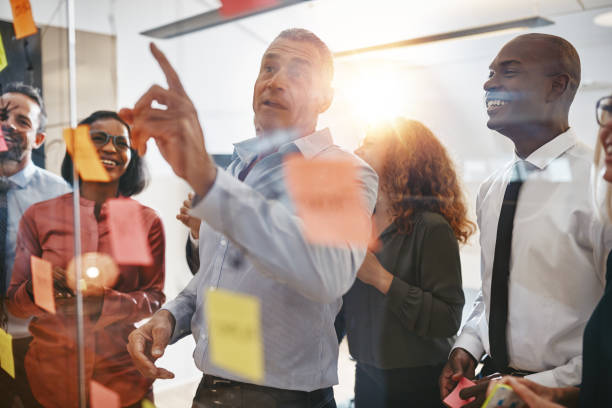 istock Manager and his team brainstorming together in a modern office 1077758468