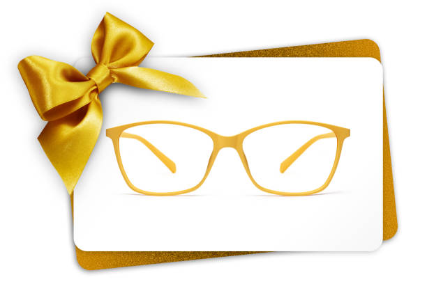 istock eyeglasses gift card, spectacles and golden ribbon bow, isolated on white background 1077761012