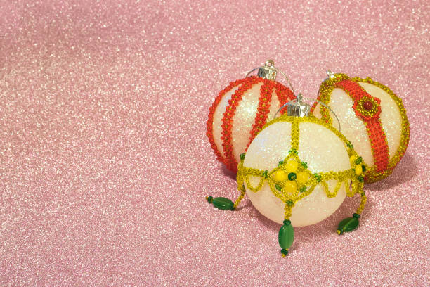 istock three Christmas balls decorated with beads on a brilliant pink background with space for an inscription. 1077761570