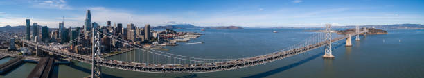 la vista aerea di san francisco, california. oakland bay bridge sulla baia di san francisco, tra downtown e treasure island - bay bridge car traffic transportation foto e immagini stock