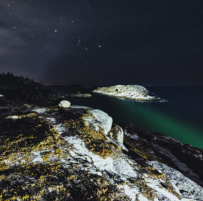The Winter constellations shine over the Peggy's Cove Preservation area.  Long exposure.