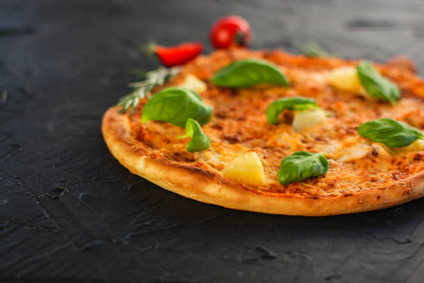 pizza, pineapple, chicken, tomato sauce, cheese, basil (pizza ingredients). Hawaiian pizza. Top view. copy space