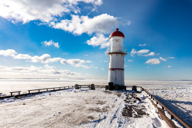 istock Lac St Louis and lighthouse Lachine Quebec in deep mid winter. 1077774352