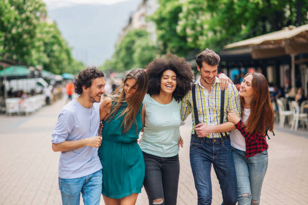 istock Happy friends on the street 1077781450