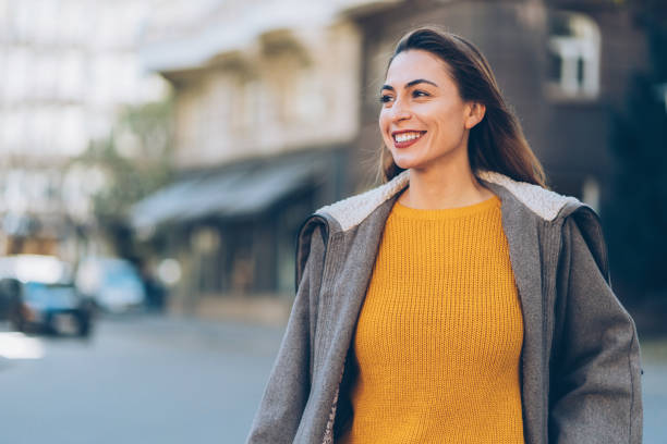 istock Woman walking on the street 1077781478