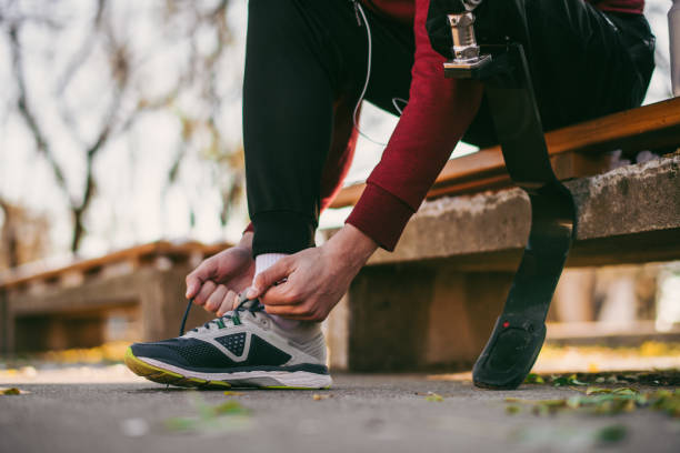 istock Young man with artificial leg on training outdoors 1077782286