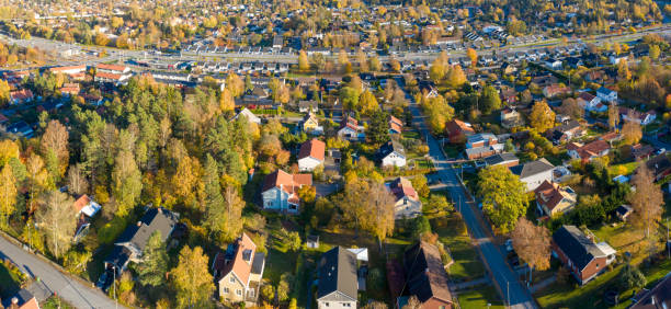 istock Panorama, flying over villa and tree area just at sunset 1077782394
