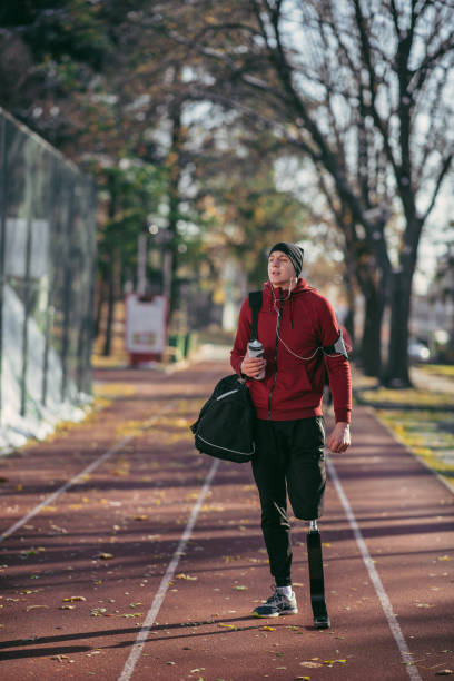 istock Man with prosthetic leg make preparation for running 1077791284