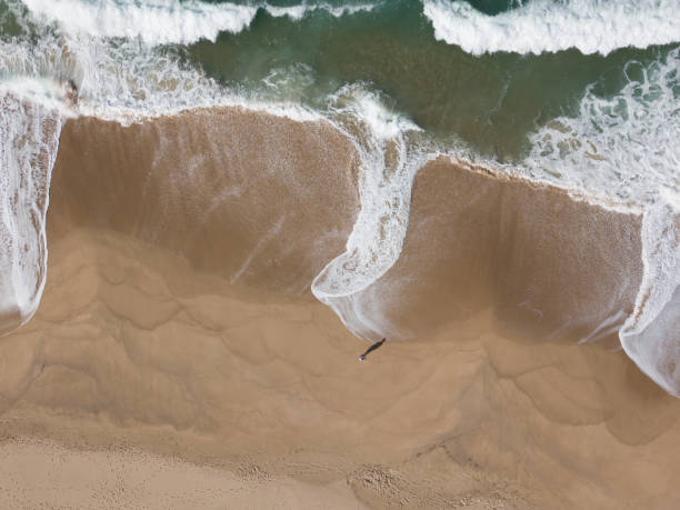 istock Man standing next to a finger of water 1077800960