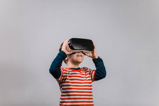 excited kid having fun with vr glasses. - virtual reality simulator imagens e fotografias de stock