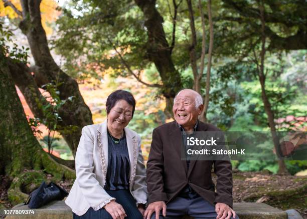 Happy Senior Couple Taking A Break In Forest Stock Photo - Download Image Now - Senior Adult, Japanese Ethnicity, Japan