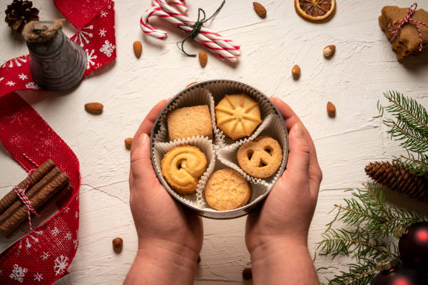 Round box with delicious biscuits above christmas table