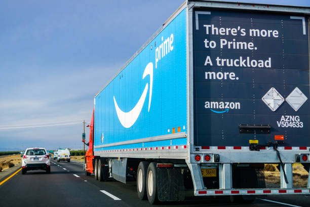 Amazon Prime truck driving on the interstate December 2, 2018 Los Angeles / CA / USA - Amazon truck driving on the interstate, the large Prime logo printed on the side amazon.com photos stock pictures, royalty-free photos & images