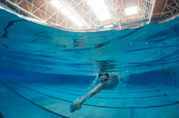 istock Swimming in swimming pool 1077827416