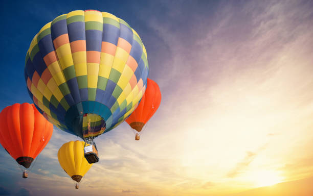 istock Colorful balloons floating in the sky at sunset. 1077832058