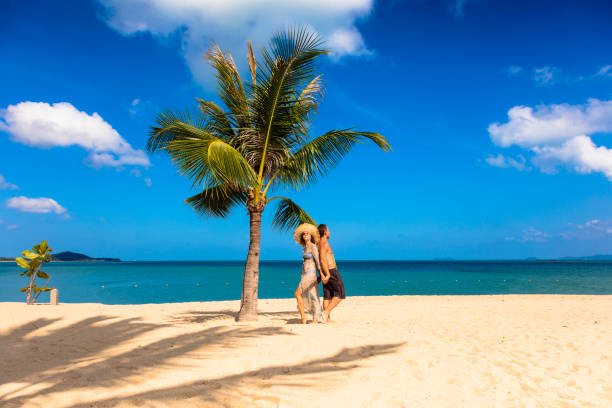 istock Couple on tropical beach 1077834836