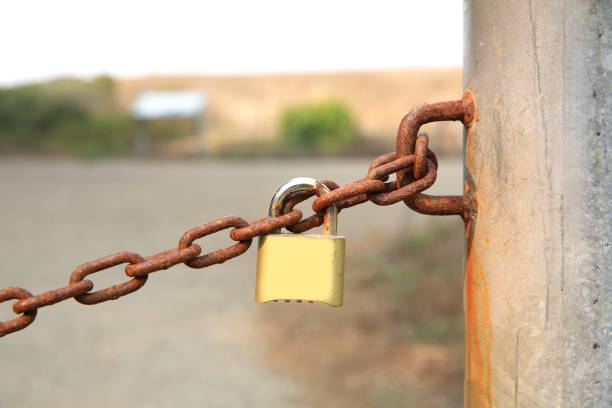 istock Golden Padlock and Chain 1077839138