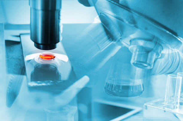 istock A pipette dropping sample into a test tube,abstract science background 1077839198