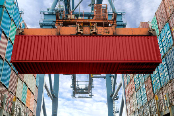 istock Industrial crane loading Containers in a Cargo freight ship. Container ship in import and export business logistic company. Industry and Transportation concept. 1077847338