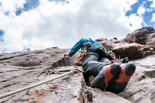 Cajon del Maipo is a valley close to Santiago de Chile on an easy drive, is an amazing place for rafting, rock climbing or just have some relaxing hike. On this picture we can see a rock climber trying to reach the summit on a cliff at Central Andes.