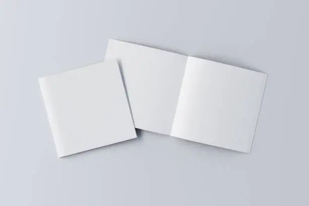 Open and closed square blank booklet on white background with clipping path around booklets. 3d illustration