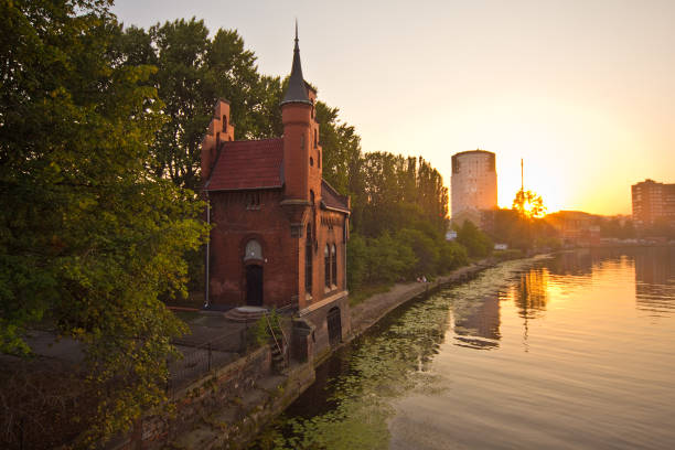 istock Summer sunset on rivet Peregolya, Kaliningrad, Russia 1077852314