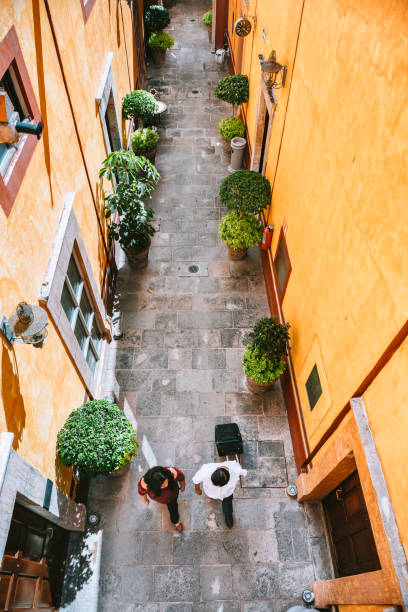 Senior Couple walking in a colonial style Mexican Hotel