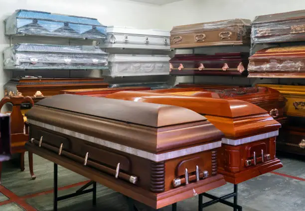 Assortment of coffins displayed in a coffin store in Oaxaca Mexico.