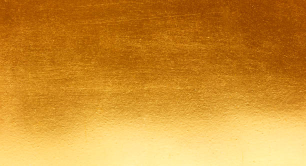 istock Shiny yellow leaf gold metall texture 1077867236