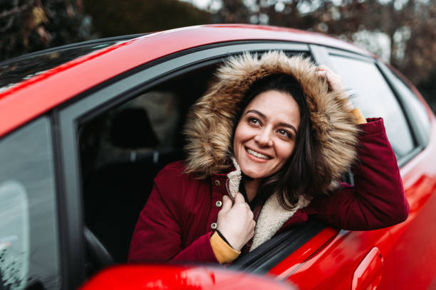istock Woman smiling in the car 1077873096