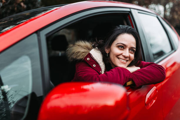 istock Woman smiling in the car 1077873144