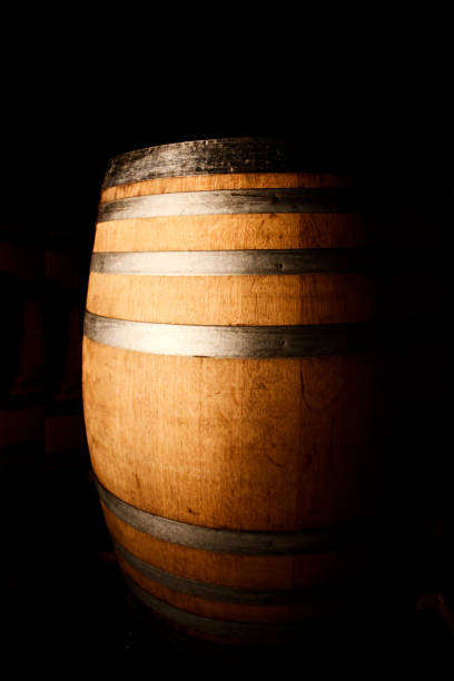 istock wooden wine barrel with metal bands 1077873366