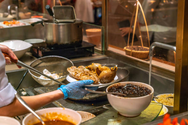 istock Chef cooking seafood in the hotel kitchen 1077874400