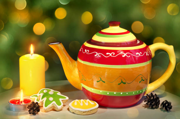 istock Christmas composition with a kettle, candles and gingerbread. 1077880238