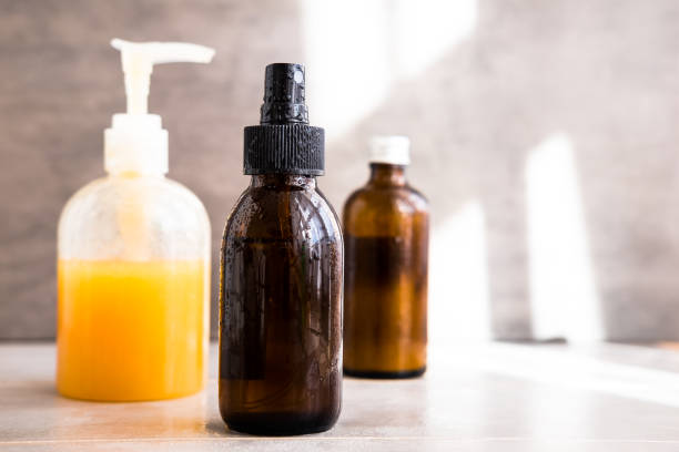 istock Spa cosmetics in bottles on gray background 1077880336