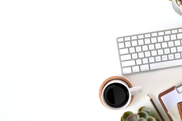 istock White office desk table workspace with a office supplies 1077880528
